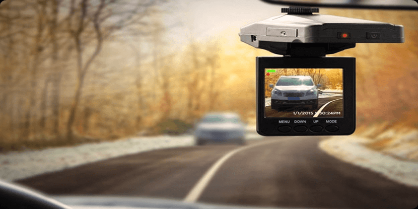 dash cam hanging from car windscreen