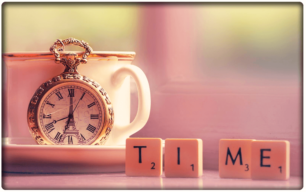 close up of a clock and the word time displayed on scrabble lettering